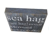 White sea hag mermaid before coffee with black background, rustic painting canvas print of painting on wood top